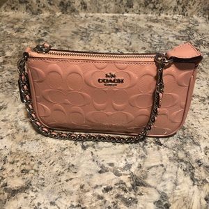 Pink patent leather Signature Coach wristlet